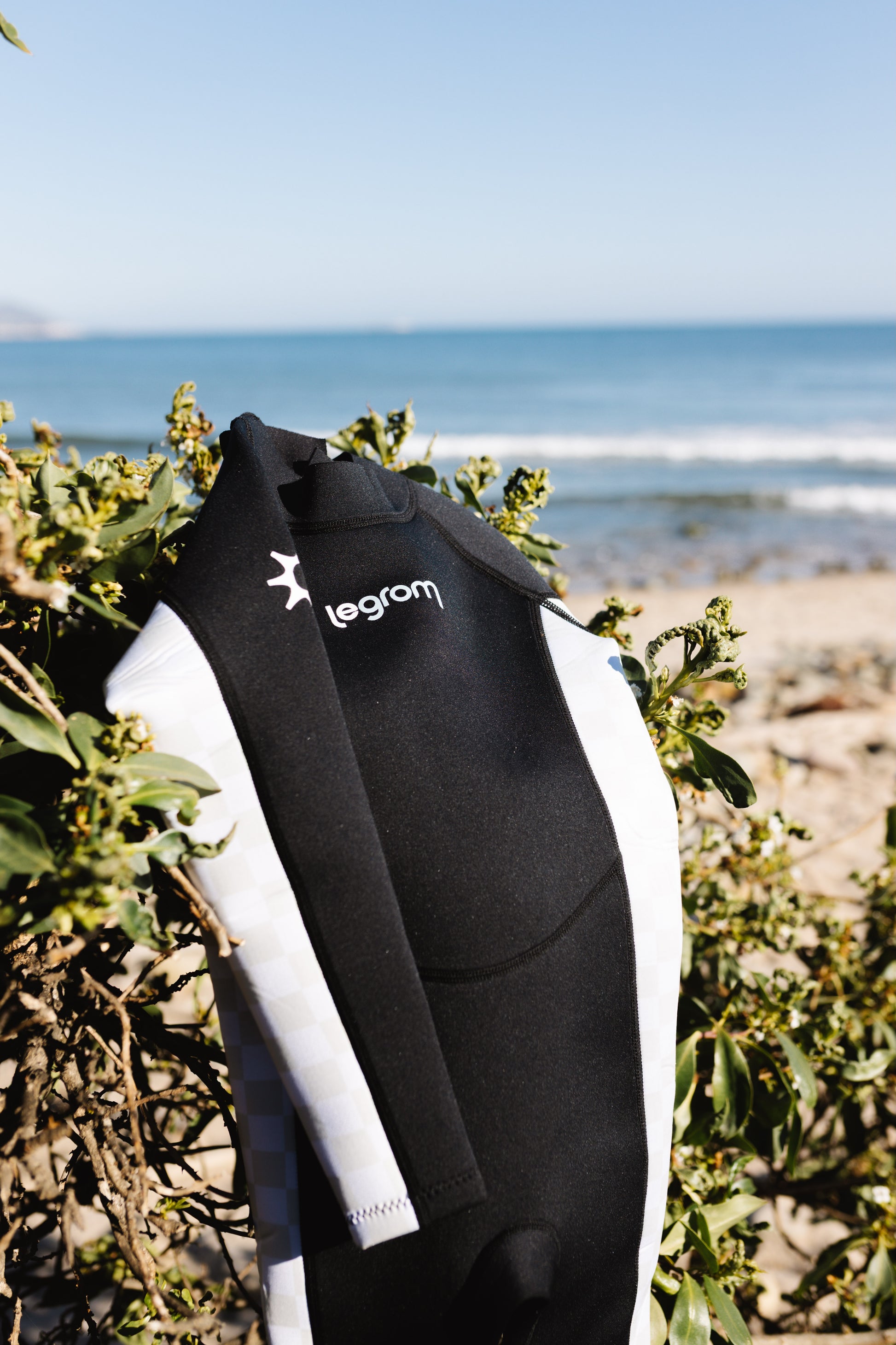 Le Grom Ash black checker toddler wetsuit product photo - full body front view with sun logo detail